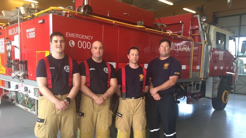 Four fire-fighters stand in front of Mildura CFA truck.