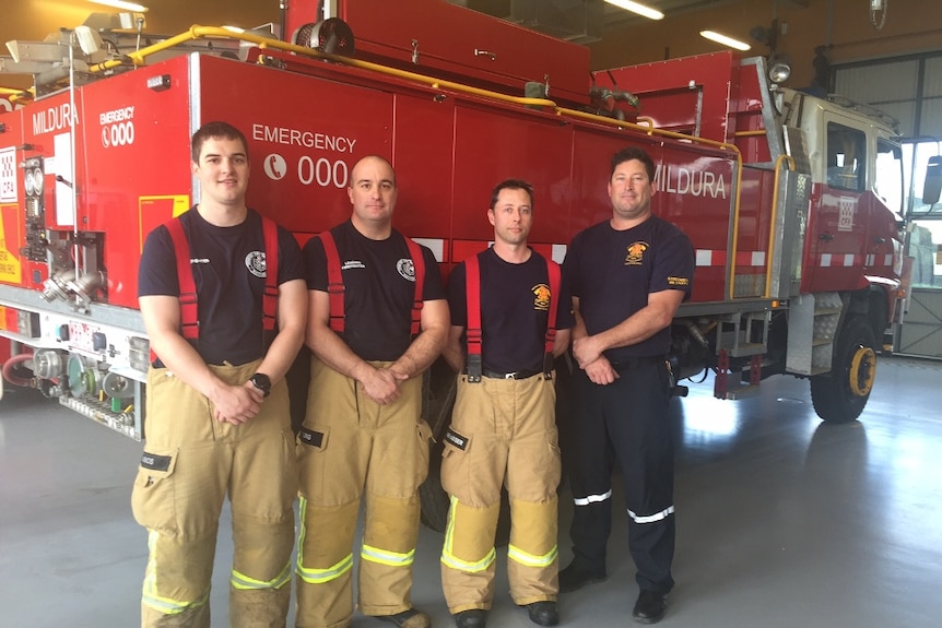 Four fire-fighters stand in front of Mildura CFA truck.