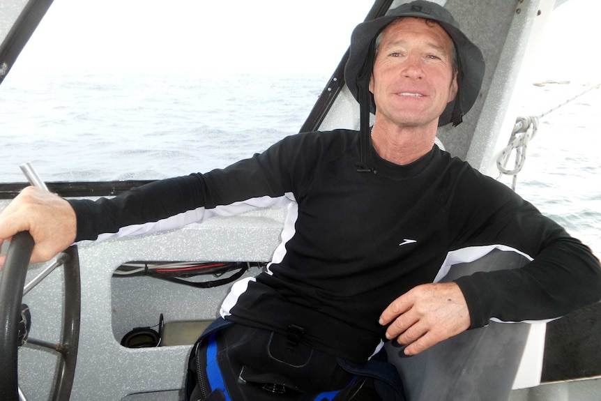 Marc Payne piloting an abalone diving boat.