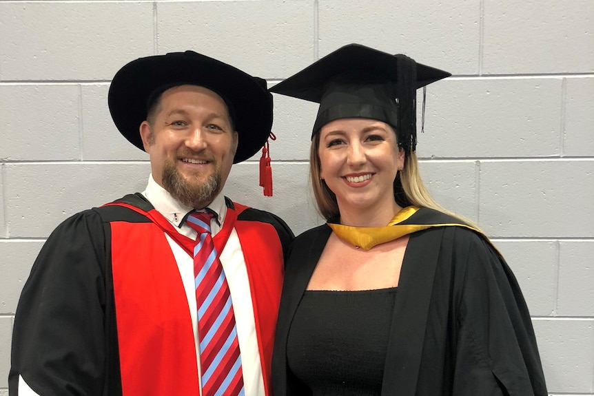 Hannah Mason with Prof Franklin in university garb.