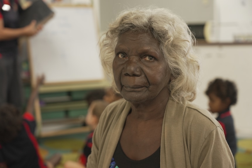 An Indigenous woman in a primary school classroom