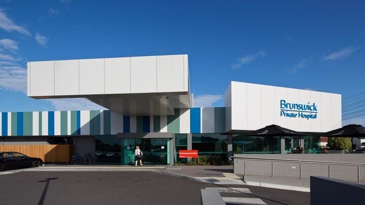 The exterior of the Brunswick Private Hospital on a sunny day.