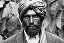 A black and white photo of an Afghan man in a turban