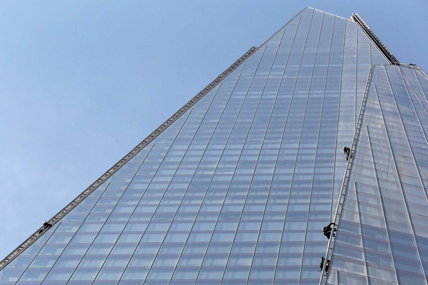 Six female protesters from Greenpeace scale The Shard in London.