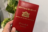 A picture of a red passport issued by from Myanmar