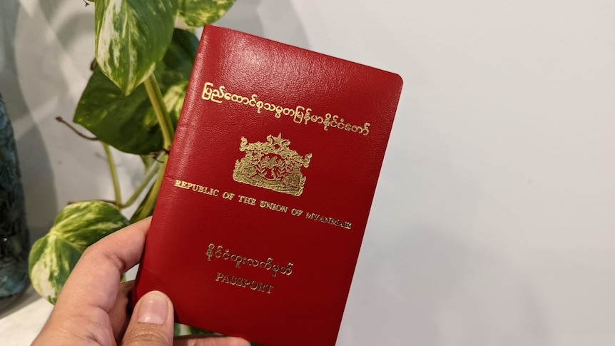 A picture of a red passport issued by from Myanmar