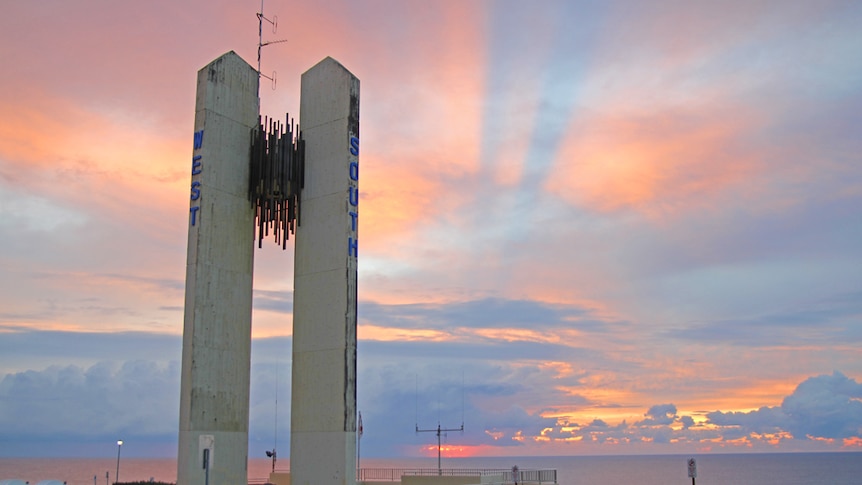 Sunrise over the Captain Cook memorial on the Queensland-New South Wales border