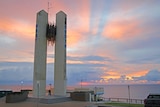 Sunrise over the Captain Cook memorial on the Queensland-New South Wales border.