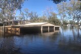 A house submerged under floodwaters