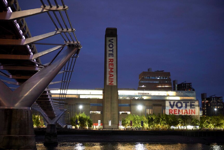 Vote Remain signs are projected onto the Tate Modern building in London.