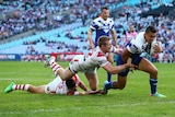 Tim Lafai scores for the Bulldogs against St George at the Olympic stadium on May 11, 2014.