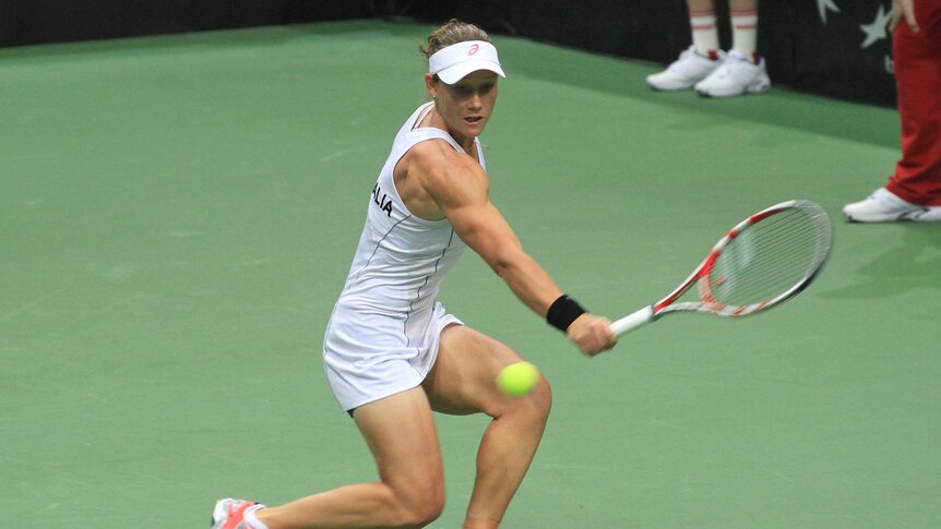 Samantha Stosur returns the ball to Lucie Safarova in Australia's Fed Cup loss to Czech Republic.