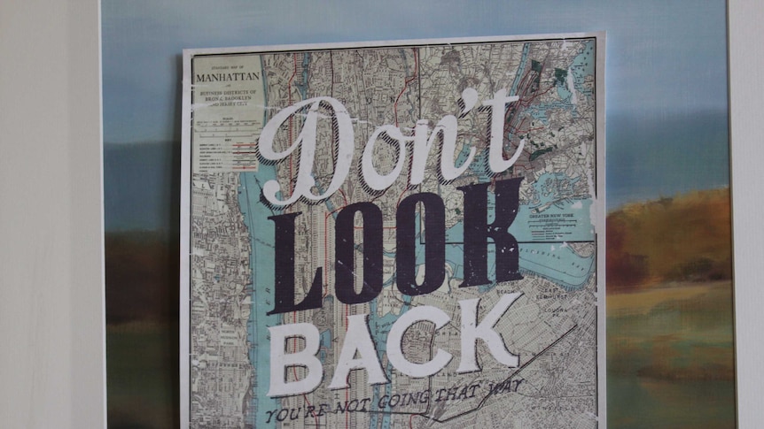 A motivational poster that reads: "Don't Look Back".