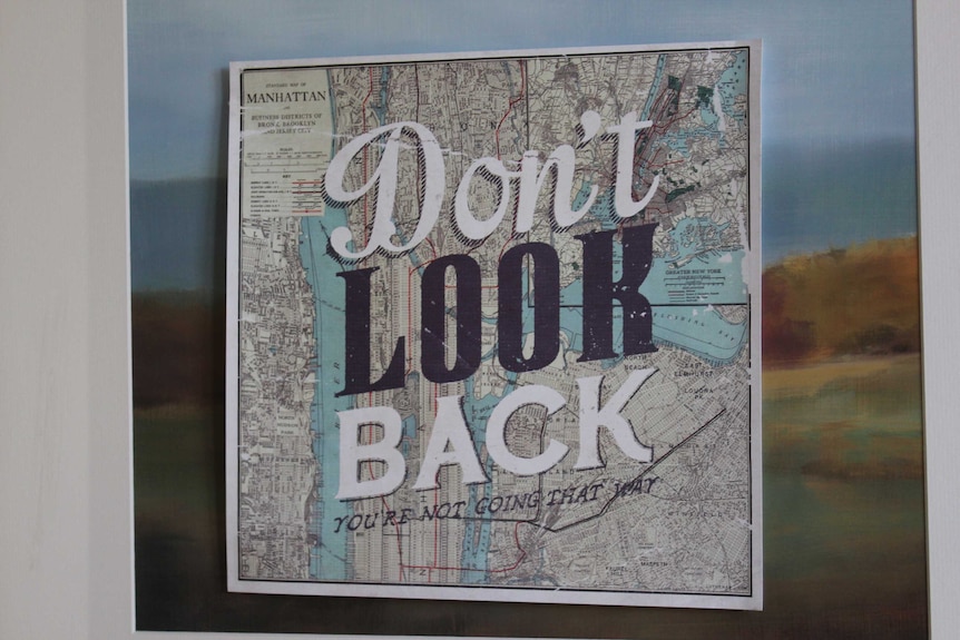 A motivational poster that reads: "Don't Look Back".