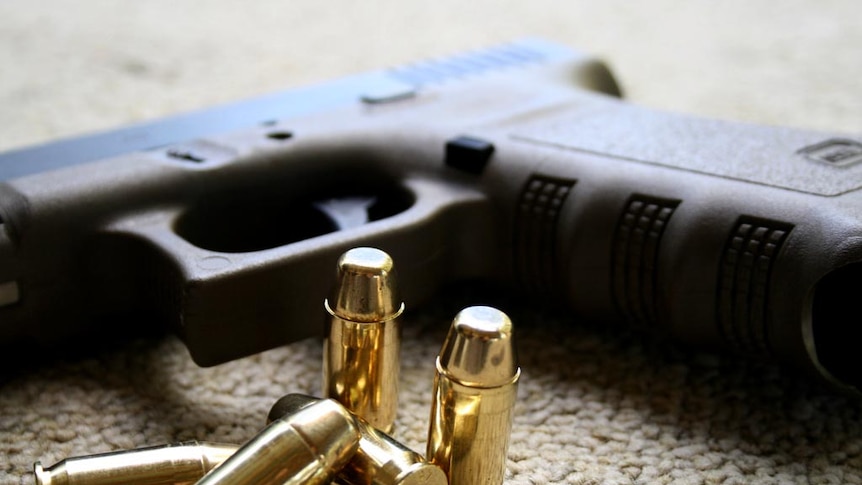 A Glock hand gun and bullets