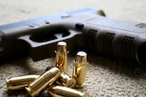 A Glock handgun and bullets