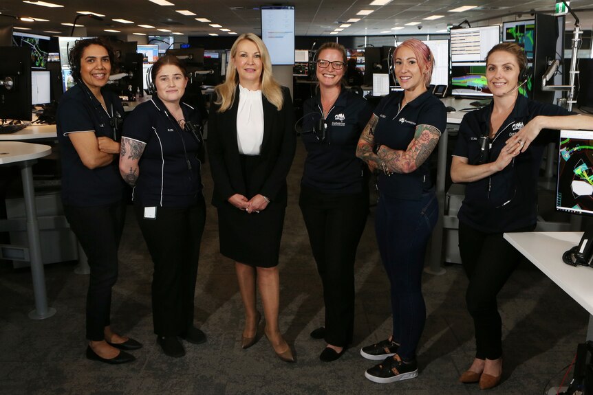 Elizabeth Gaines with five other female employees.