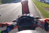 view from a helmet camera of a motorbike on road 