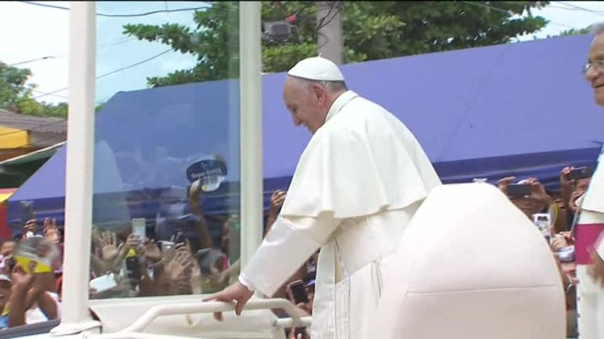Pope knocks head in Popemobile in Colombia
