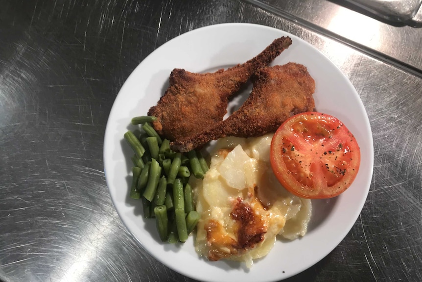 Lamb cutlets and vegetables.