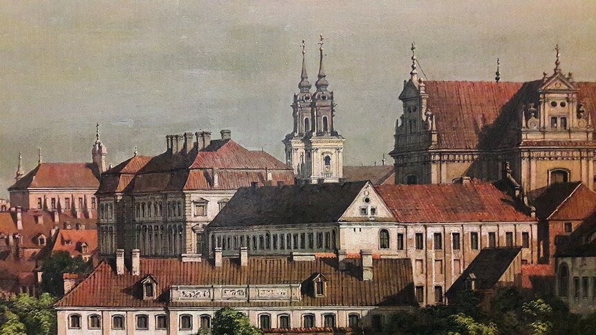 A detail of neoclassical painting of Warsaw shows red roofs and church bell towers.