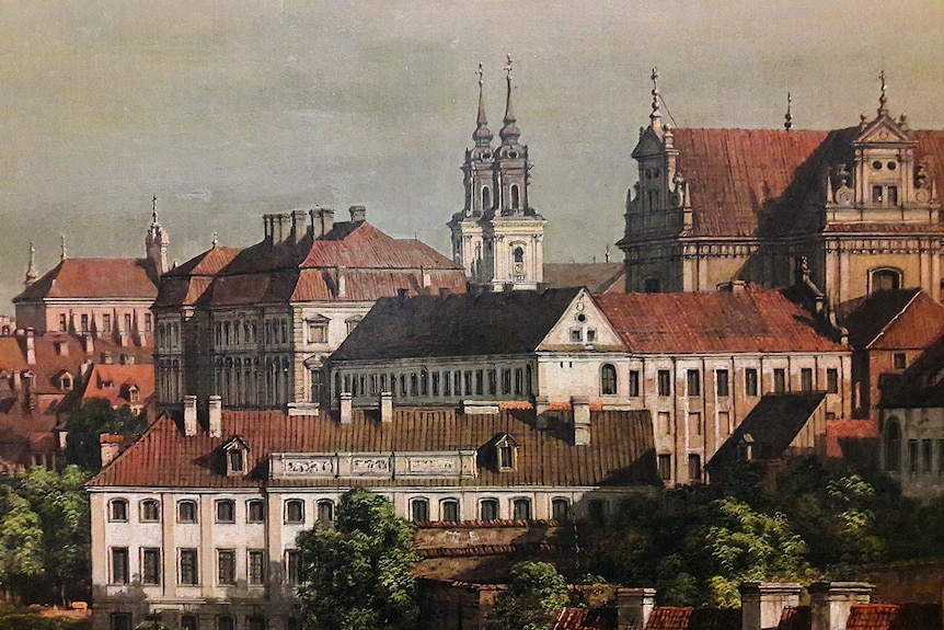 A detail of neoclassical painting of Warsaw shows red roofs and church bell towers.