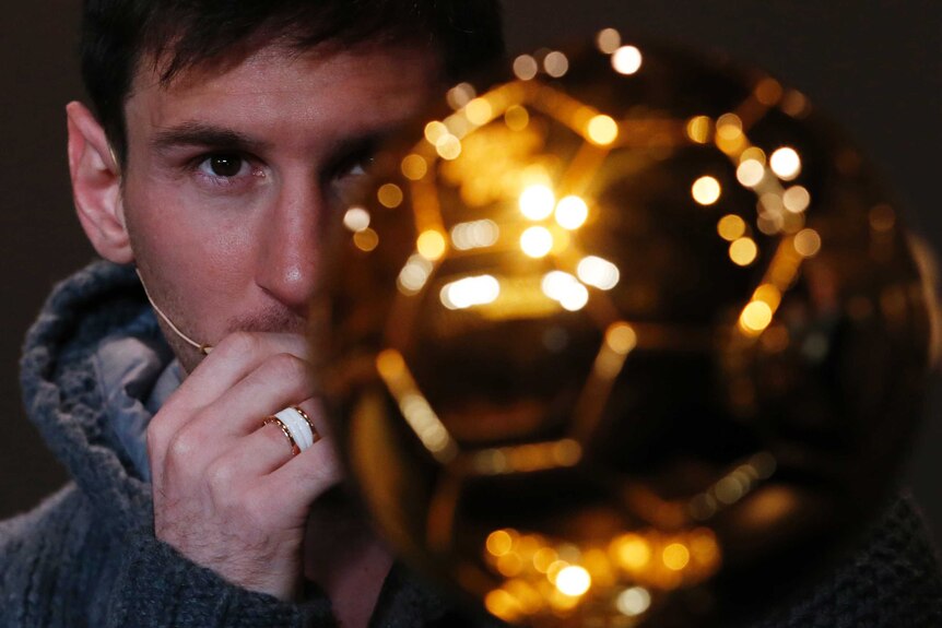 Lionel Messi looks at the Ballon d'Or