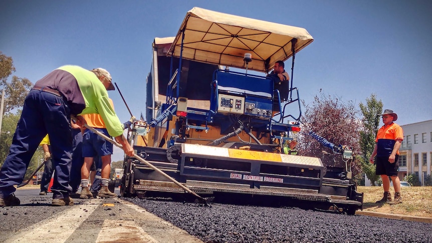 Construction workers in 40 degree heat in Canberra on Wednesday January 15, 2014. At Clunies Ross Street, Acton. Good generic.