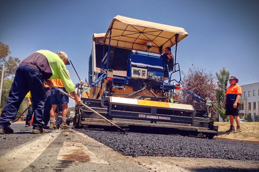 Construction workers in 40 degree heat in Canberra on Wednesday January 15, 2014. At Clunies Ross Street, Acton. Good generic.