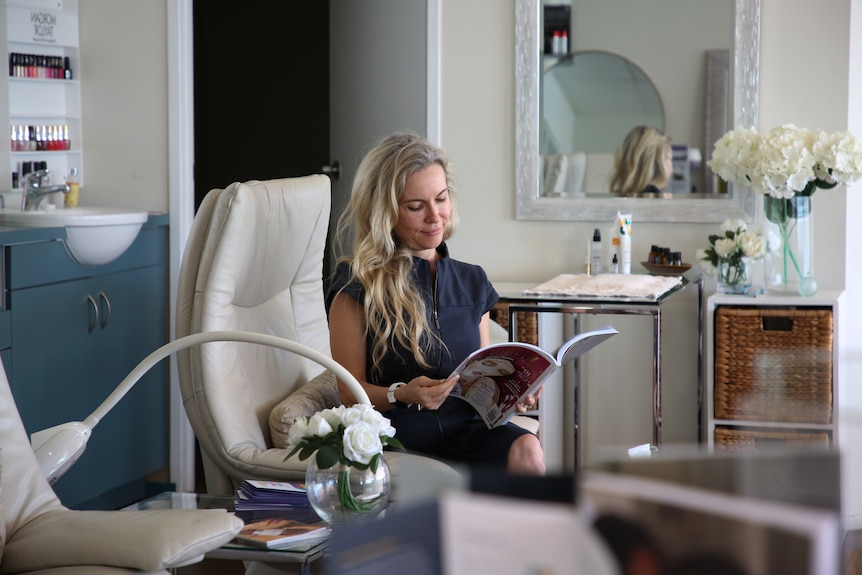 A photo of Darwin businesswoman Marii Oblescuk sitting in her wellness centre.