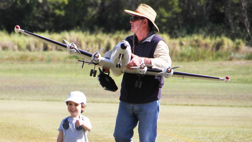 Man and boy with model aircraft