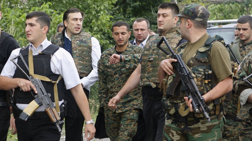 Georgian President Mikheil Saakashvili (2nd left) and Defence Minister David Kezerashvili (3rd left)