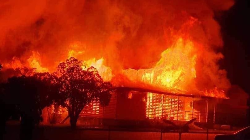 Huge orange and red flames engulf a catholic church in Bundaberg.