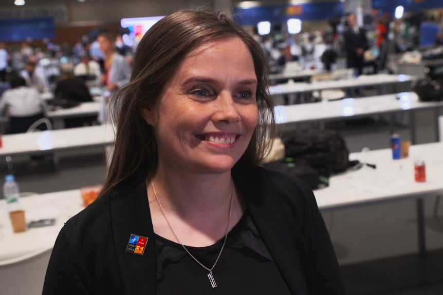 Iceland's Prime Minister Katrin Jakobsdottir smiles while being interviewed.