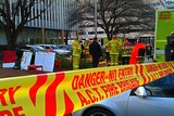 Police and firefighters with hazardous material equipment collected a sample of the powder for testing.