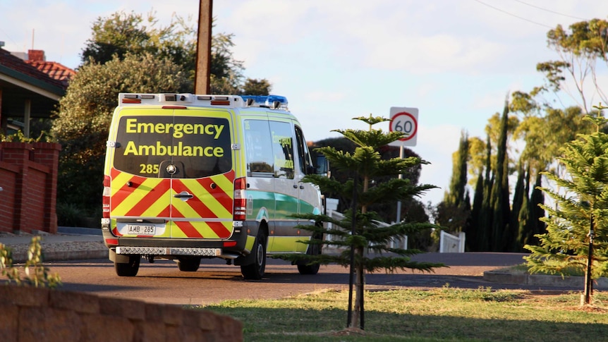 Ambulance driving away from camera.