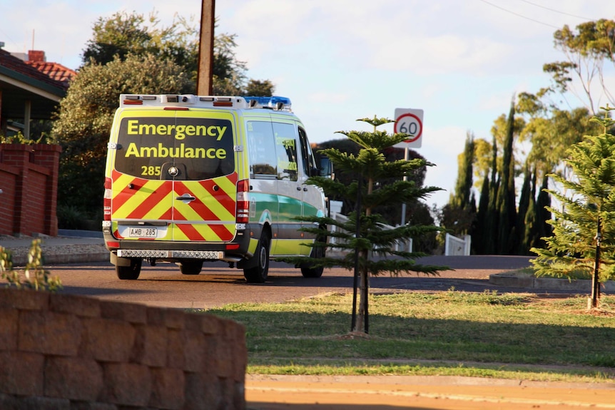 Ambulance driving away from camera.