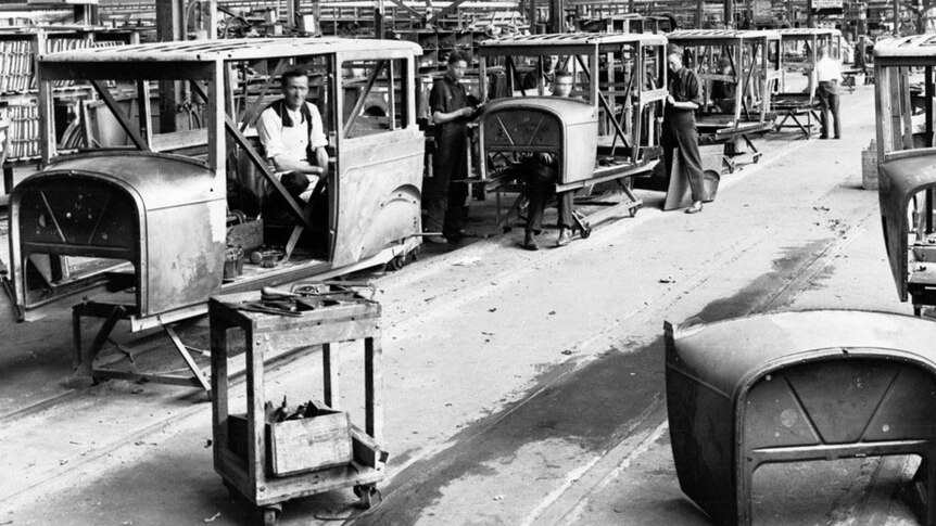 A production line of old Holden cars