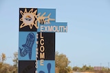 Welcome signage located at the entrance to Exmouth - a popular tourist destination in the north west of Western Australia.