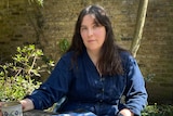 Author Evie Wyld siting outside