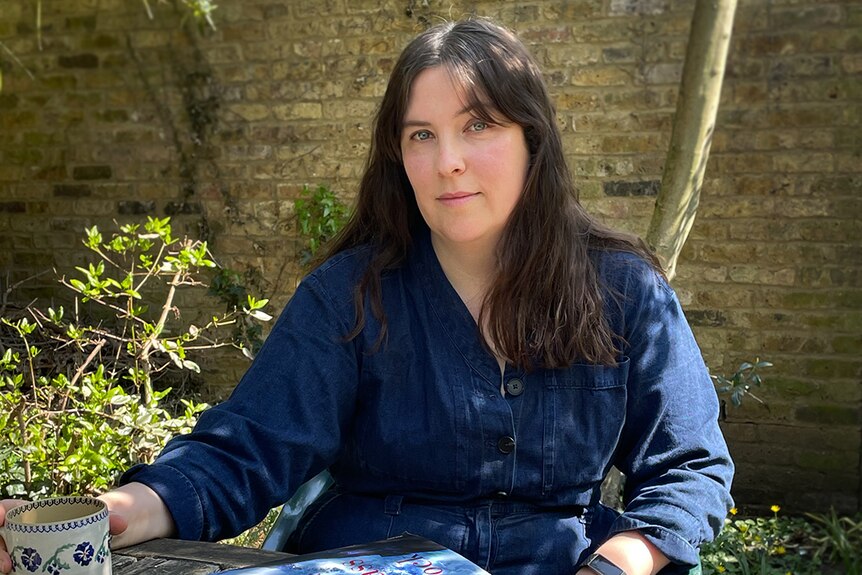 Author Evie Wyld siting outside