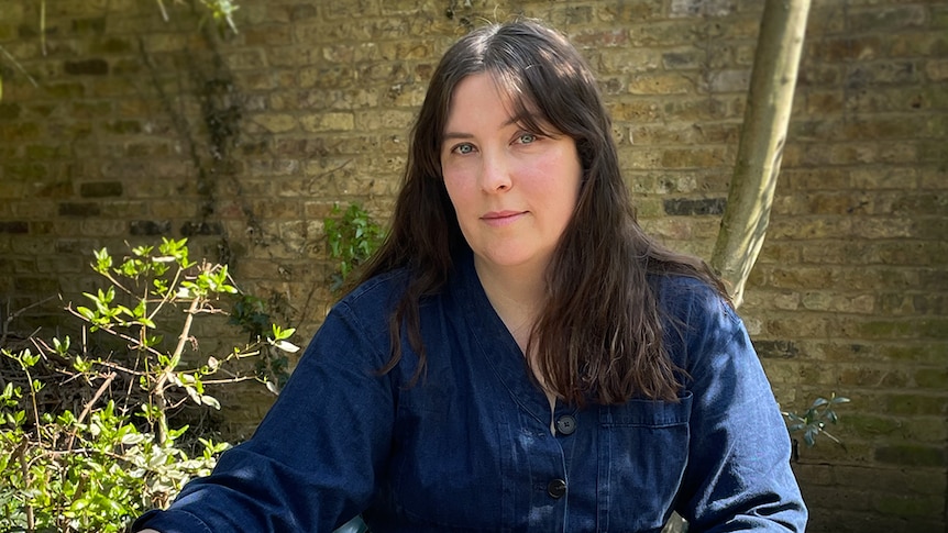 Author Evie Wyld siting outside