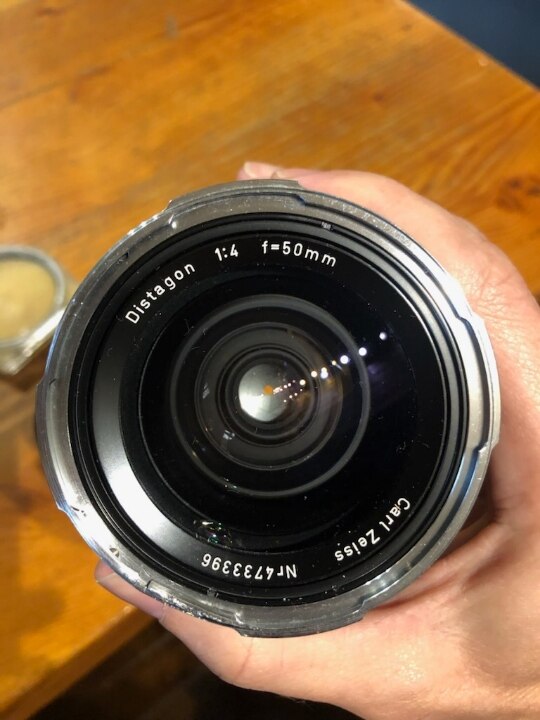 A camera lens photographed looking straight down its barrel