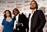 Rowan McNamara, with Kath Shelper and Warwick Thornton pose for photos with their award