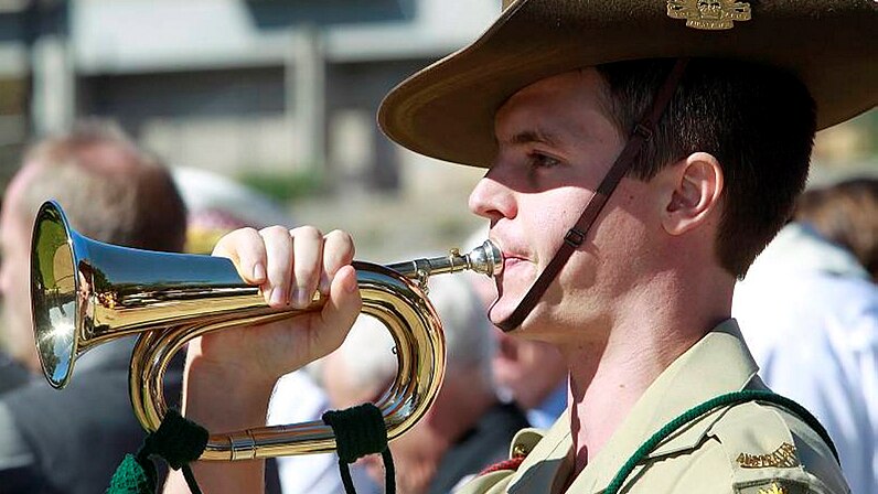 A Bugle player sounds the last post during the Anzac Day Ceremony at Civic Park in Newcastle.