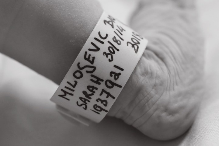 A name tag on a baby's foot 