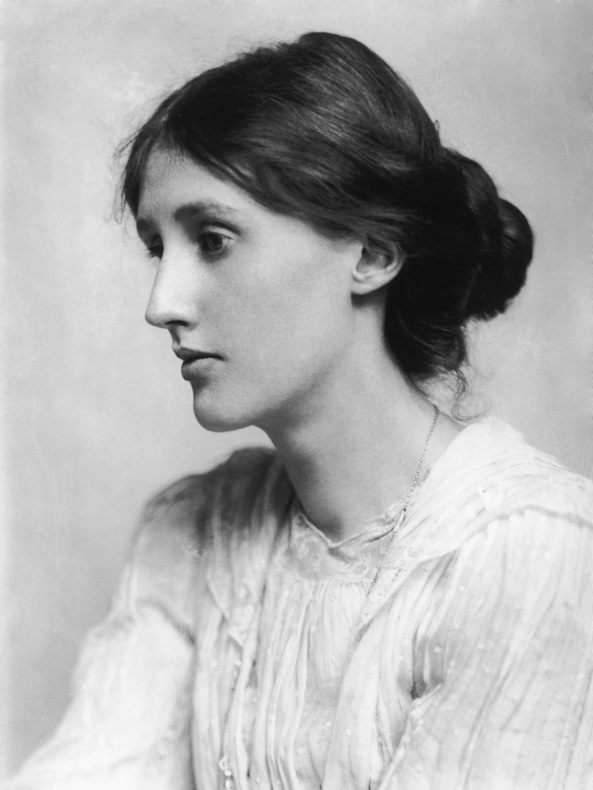 A classic black and white photo of Virginia Woolf, her hair in a loose bun, looking away from the camera