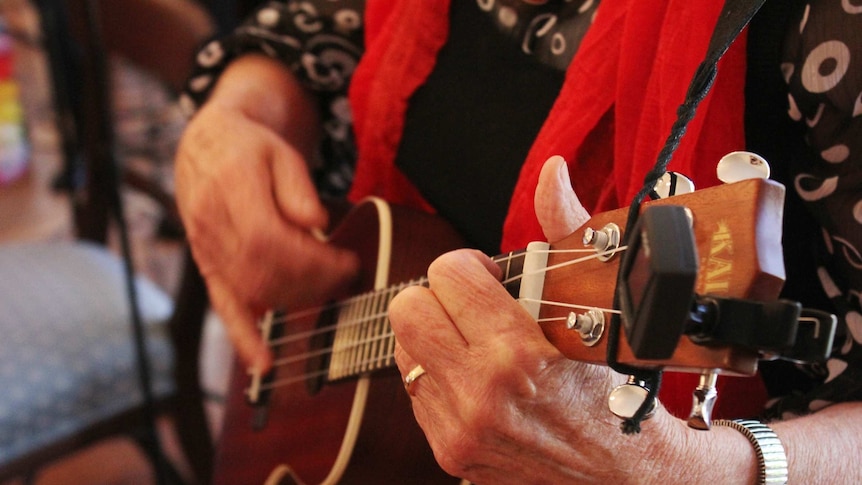 A close up of a ukulele during a performance in Hobart.