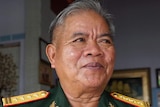 A Vietnamese war veteran wearing a uniform.