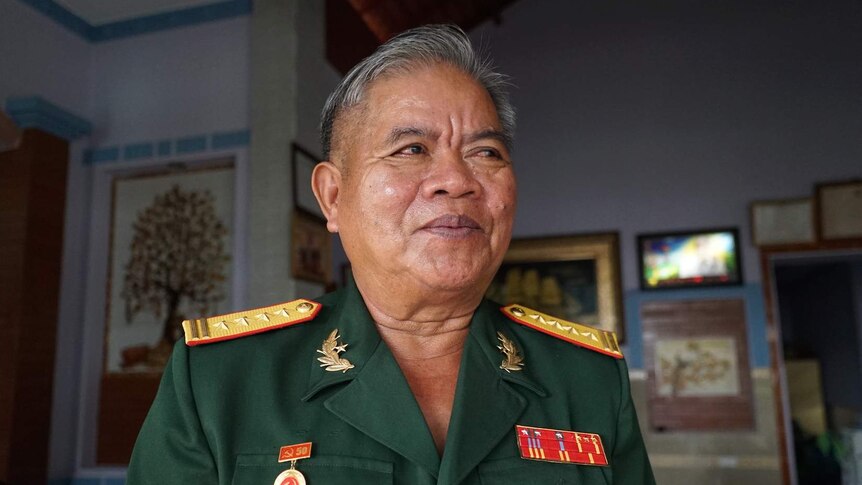 A Vietnamese war veteran wearing a uniform.